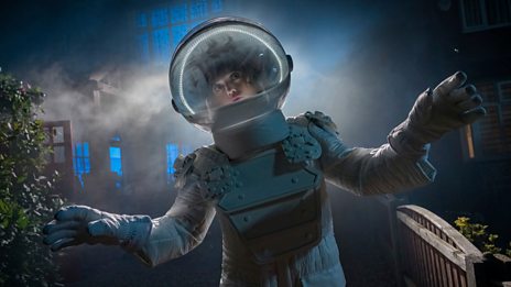 A person in a space suit explores a foggy, dimly lit environment, evoking a sense of mystery and adventure.